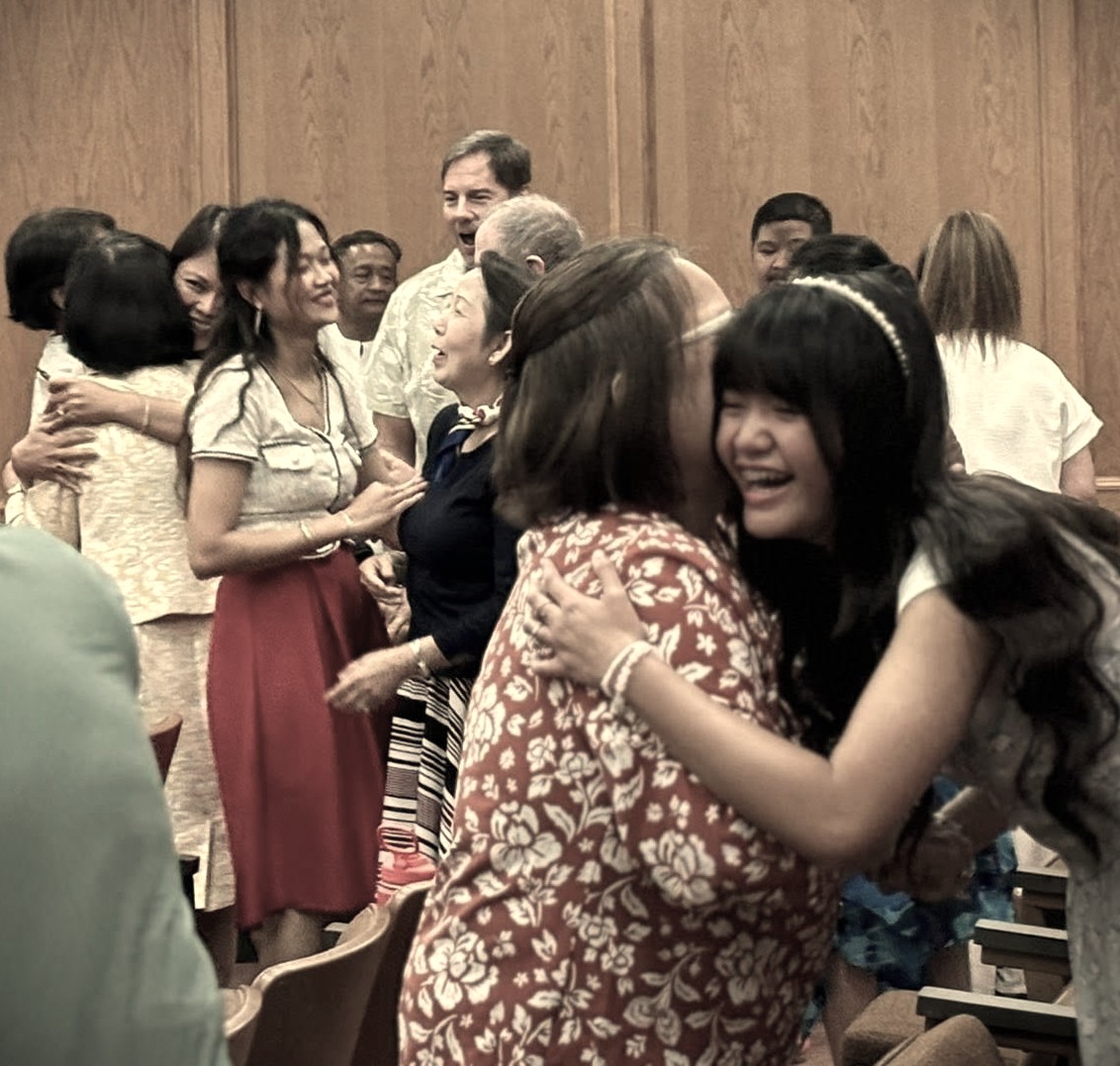 Multicultural congregation at New International Church, Garland TX, in fellowship after worship